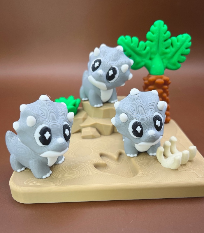 Photoroom_20260729_184454 Baby Triceratops with Desert Showcase | 3D Printable Files (STL, 3MF) - Image 1